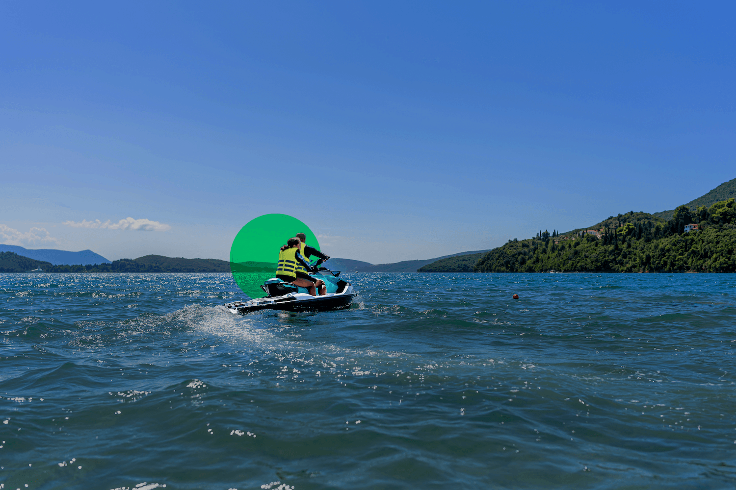 Layered mountain ranges with evergreen forest and clear blue sky, scenic mountain wilderness landscape