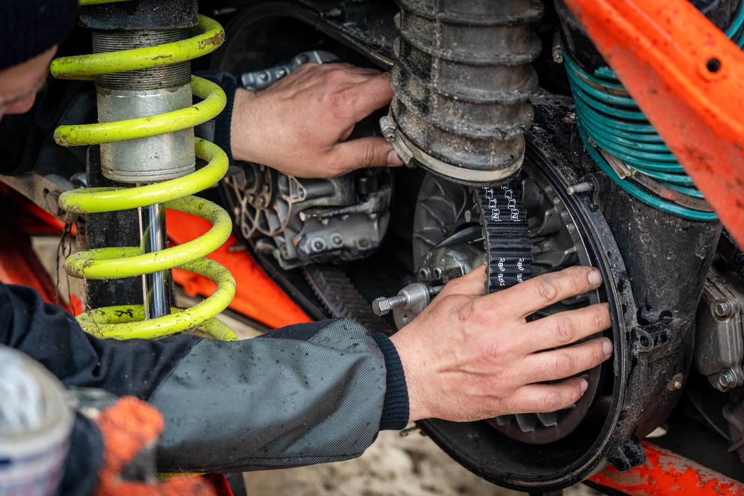 Man repairing motorcycle engine
