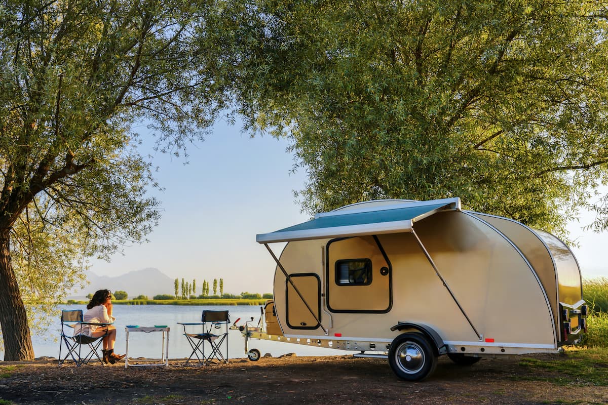 RV interior showcasing personal effects coverage with laptops, gear, and camping equipment