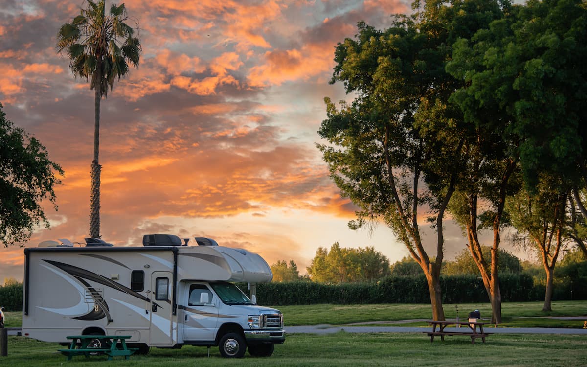 RV campsite setup with extended awning demonstrating emergency expense coverage