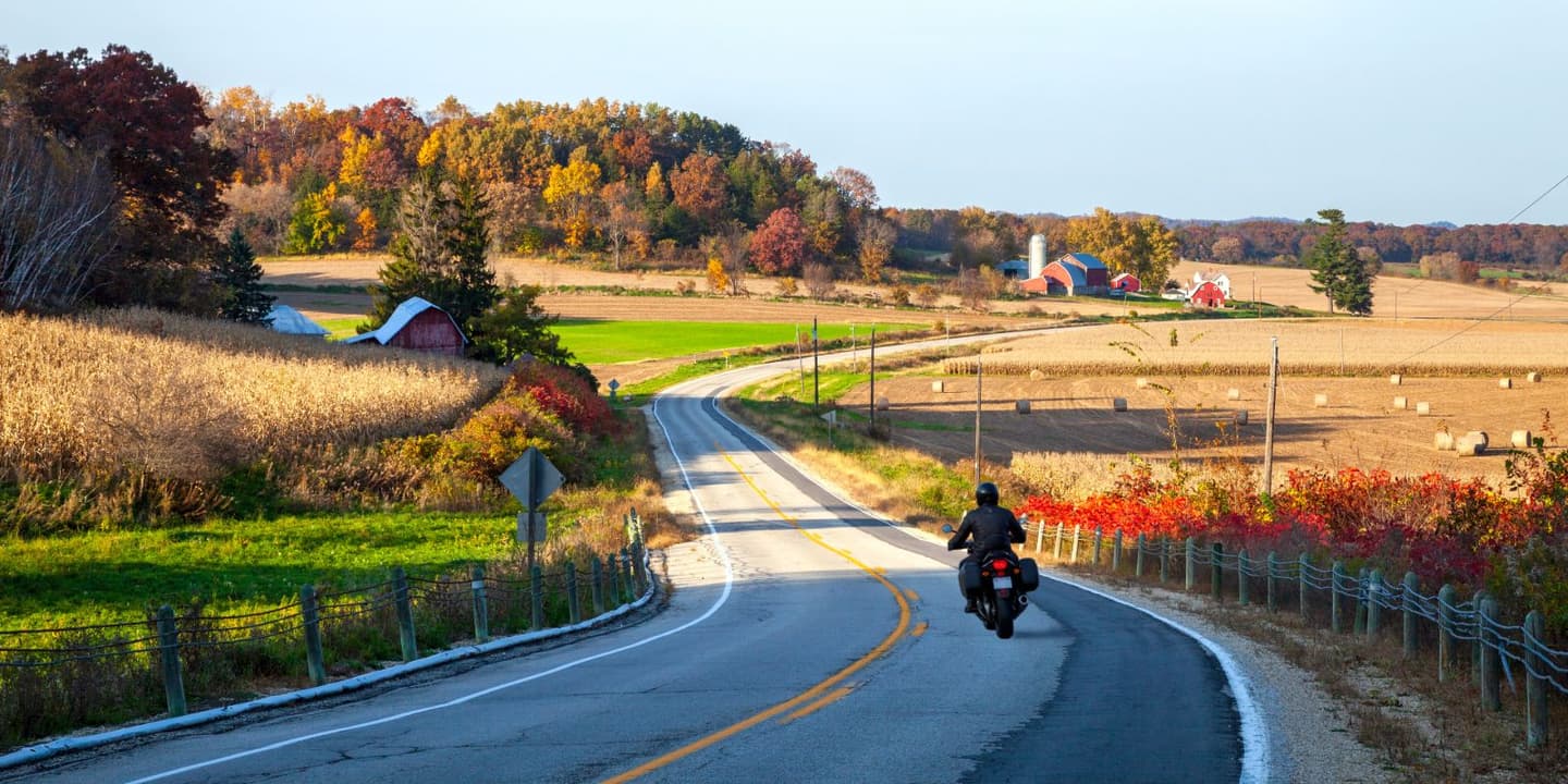 Motorcycle rider traveling through a scenic road in Wisconsin