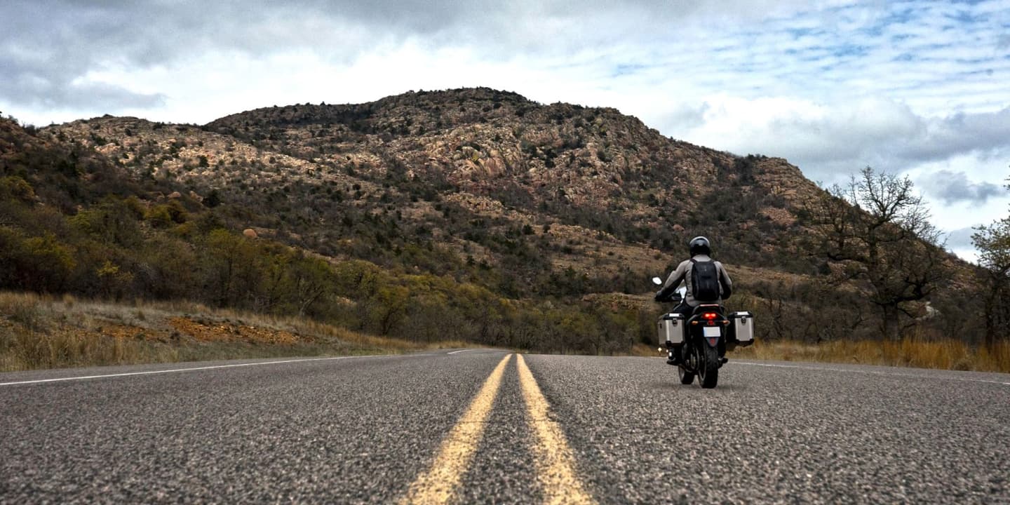 Motorcycle rider traveling on a scenic road in Oklahoma